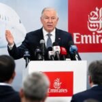 Emirates Airline Recovery Outlook showing Emirates A380 aircraft flying over Dubai skyline during airline growth recovery